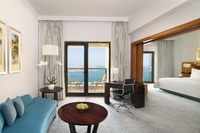 King bed, lounge, balcony, pool.
