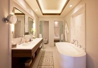 King bed and private terrace with sun loungers.