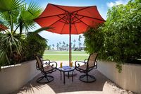 Private terrace with sun loungers & umbrella.