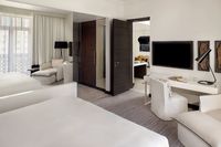 Junior suite with city view balcony.