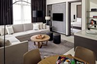 Junior suite with city view balcony.