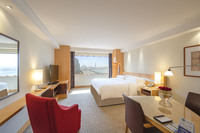 Panoramic views, modern style, deluxe amenities.