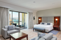 Spacious deluxe suite with balcony.