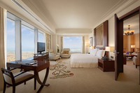 Luxurious suite with lounge access.
