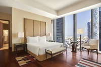 King Bed with Amenities, Balcony, and Burj View.