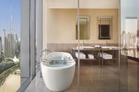 King Bed with Amenities, Balcony, and Burj View.