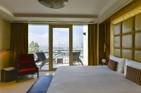 Luxurious suite with terrace and skyline view.
