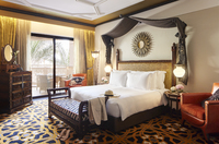 Luxurious suite with canopied bed.