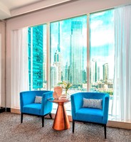 Views of Burj Khalifa and Dubai Downtown skyline.
