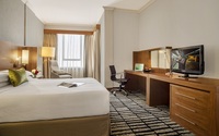 King bed, living room, coffee and tea maker.