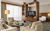 King bed, sitting area, coffee maker.