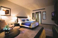 Spacious suite, city view, dining area.