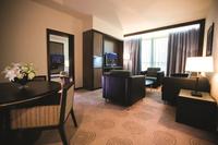 Spacious suite, city view, dining area.