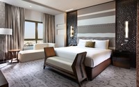 Spacious suite, king bed, amenities.