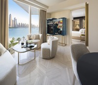 Full-length windows, comfortable King-size bed.