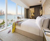 Full-length windows, comfortable King-size bed.