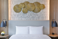 Modern room with king bed, city views.