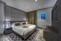 Modern city-view studio with balcony.