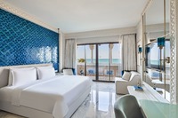 Luxurious Gulf view room with Mediterranean decor.