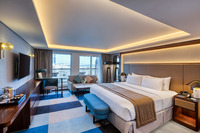 Skyline-facing balcony with waterfront view.