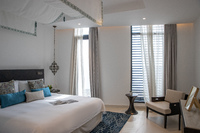 Luxurious beachfront villa, private terrace, pool.