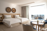Ocean view, balcony, cozy seating.