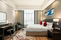 Modern suite with living and work areas.