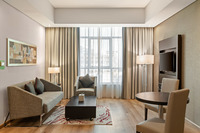 Modern suite with living and work areas.