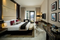 Elegant room, balcony, skyline views.