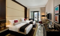 Elegant room, balcony, skyline views.