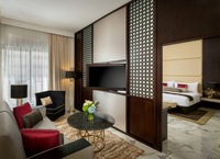 Spacious suite, balcony, city views.