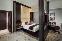 Elegant suite, balcony, city views.