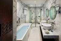 Elegant suite, balcony, city views.
