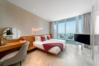 Floor-to-ceiling windows, private balcony, homely.