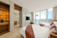 Floor-to-ceiling windows, private balcony, homely.