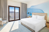 Comfortable, modern room with city views.