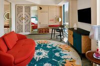 Spacious suite with vibrant lounge area.