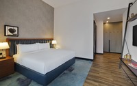 King beds, balcony, three HDTVs.