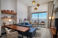 King beds, balcony, three HDTVs.