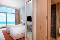 Double beds, balcony, and panoramic sea view.