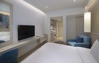 Comfortable room with fully equipped kitchenette.