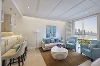 With separate lounge, dining areas, and kitchen.