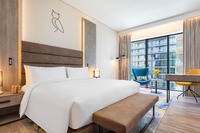 Cozy, tech-equipped room with amenities.
