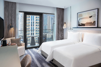 Relaxing, vibrant Deluxe Room, city views.