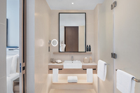 Relaxing, vibrant Deluxe Room, city views.