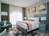 Separate bedroom and living room with sofa bed.