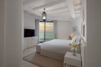 Light-toned decor and plush furnishings.