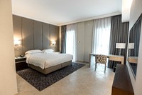 King and Twin Beds with Balcony and Sea View.