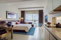 Studio with king bed, kitchenette.