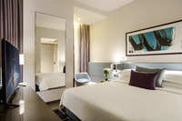 Two-bedroom suite, kitchenette, workspace.